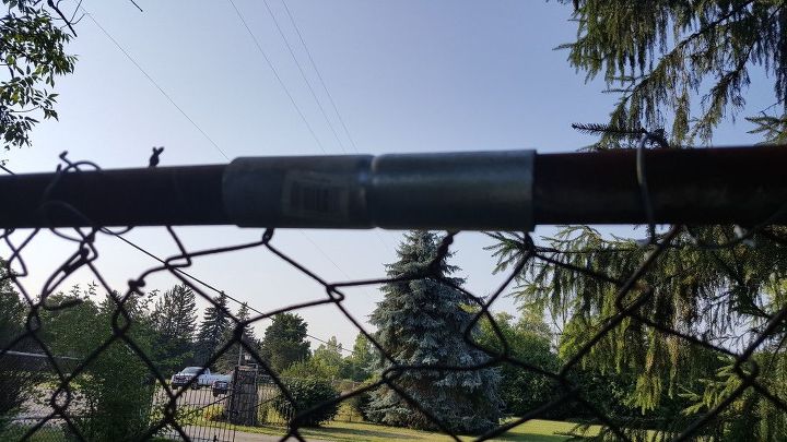 fixing a broken top rail on a chain link fence