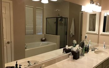 How to you take down a huge builders grade bathroom mirror?