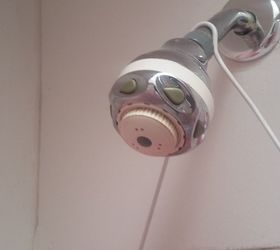 q how can i clean this shower head it doesn t come off