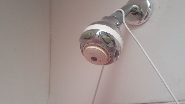q how can i clean this shower head it doesn t come off