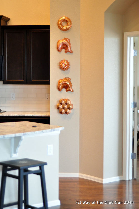 s 30 creative ways to repurpose baking pans, Hang it as metal wall decor in your kitchen