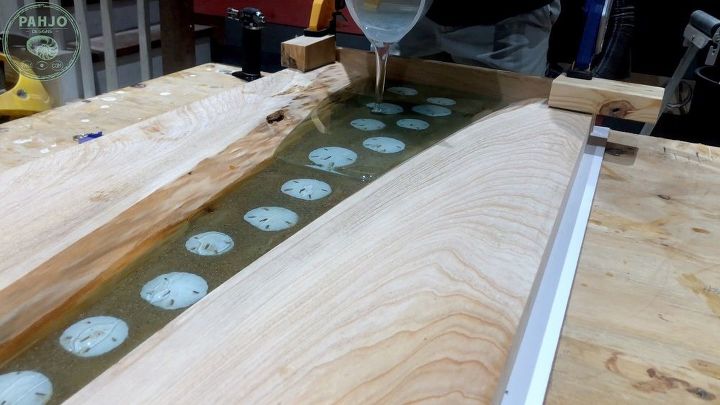 beach inspired river table with sand dollars glows in the dark
