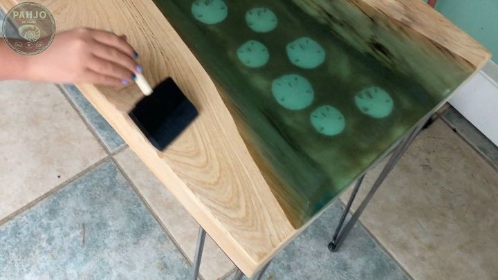 beach inspired river table with sand dollars glows in the dark