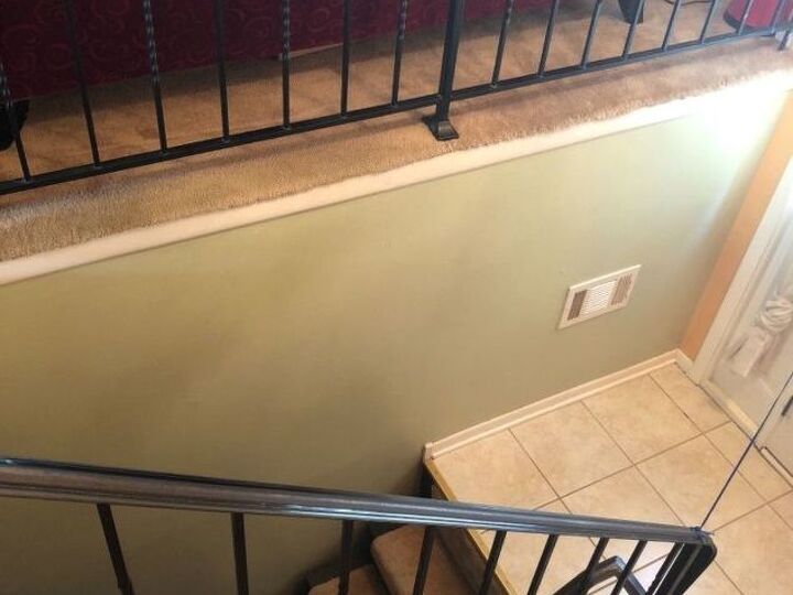 q painting iron rails in the house