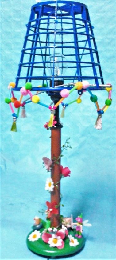 bedside birdcage lamp with a foot in miniature fairy garden and switch