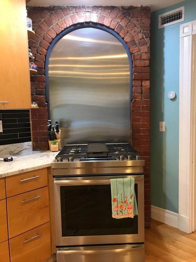 q any ideas on what to do with this odd space over my stove