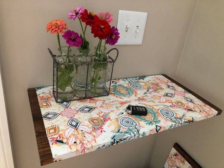 how i dressed up my wood wall shelf with mod podge and gift wrap