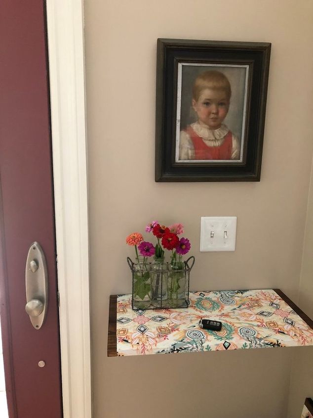 how i dressed up my wood wall shelf with mod podge and gift wrap