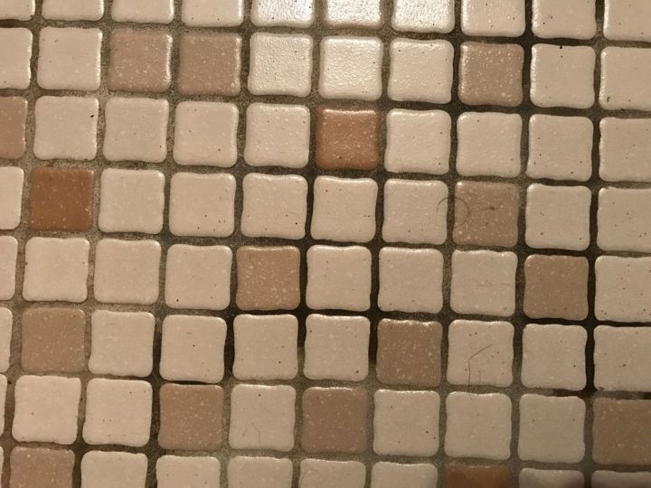 q how do i clean the grout between the tile on a bathroon floor