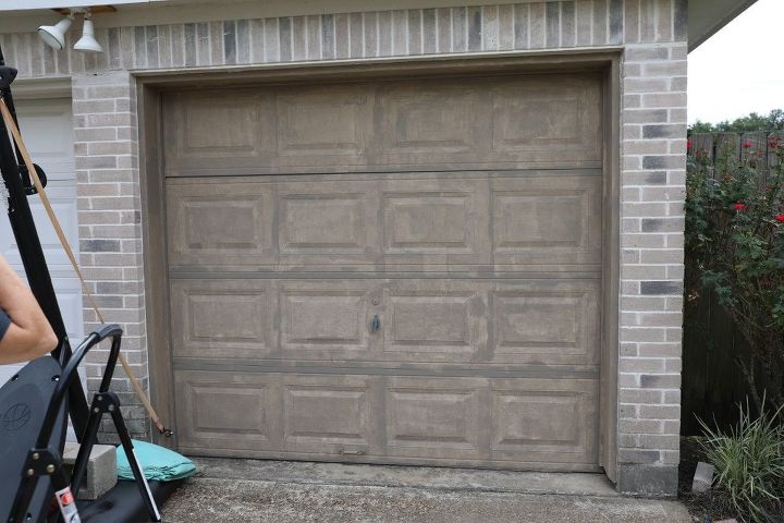 creating a faux wood garage door, One coat of paint and looking worse