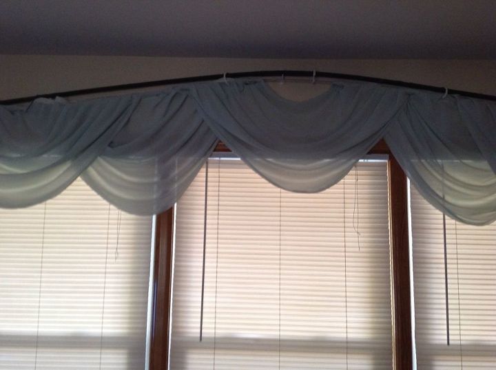 q how do i hang a floating curtain rod under a decorative rod