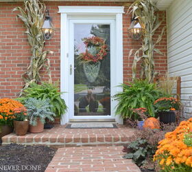 s 17 inviting fall front porch ideas, Nothing says fall like seasonal greenery
