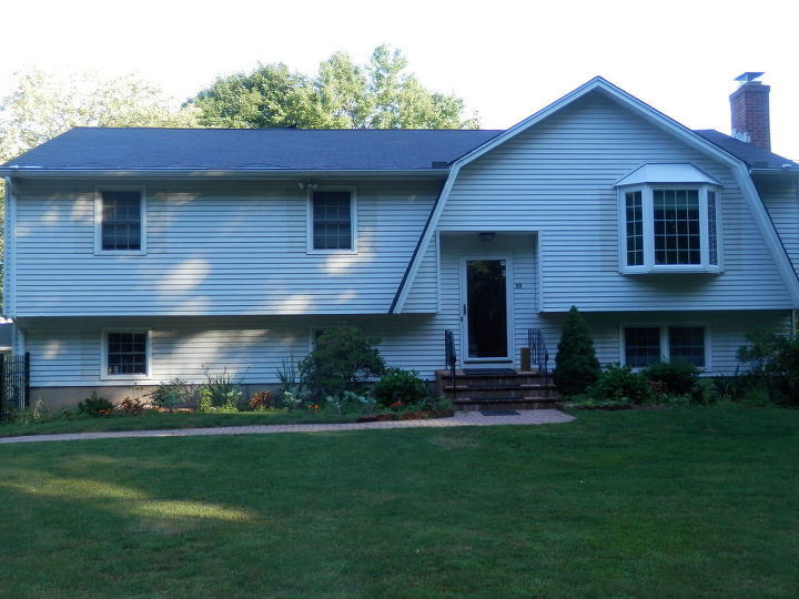 q how to eliminate the four steps to front entrance of my raised ranch