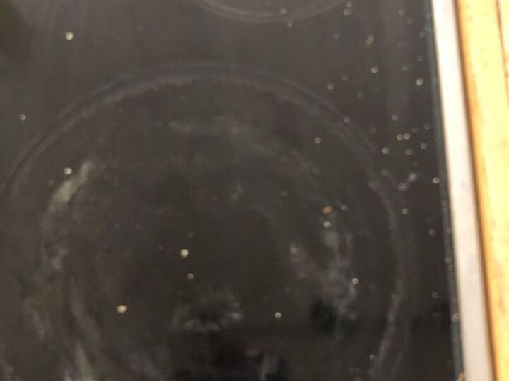 q how to clean an electric stove top