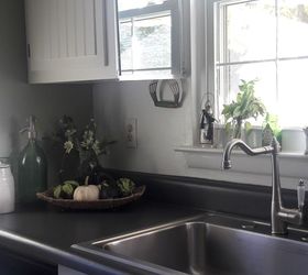 brighten your kitchen sink area with mirrors