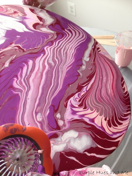 acrylic paint pour using a sink strainer
