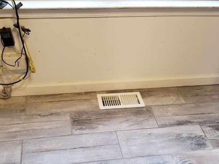 q put laminate or hardwoodflooing over tile