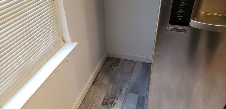 q put laminate or hardwoodflooing over tile