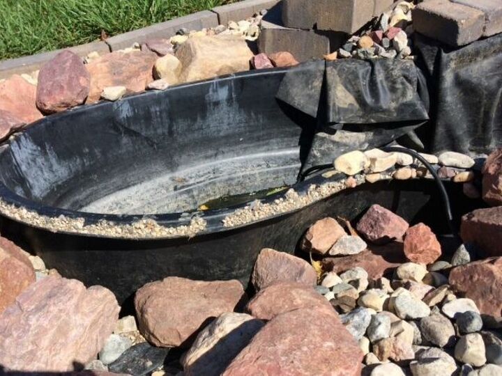 q i have a preformed pond i have put unground it keeps lifting up