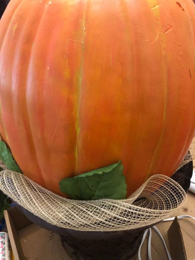 pumpkins upcycled, Tuck it in as you go around gluing leaves