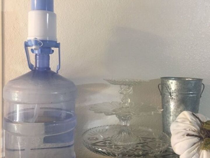 q how do i hide an ugly 5 gallon water jug with a top pump
