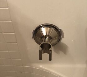how to remove a plastic shower mount from the wall