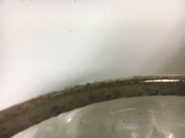 how to remove rust on a silver plated rim on a cut glass bowl