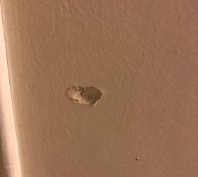 how can i repair a small dent in my wall