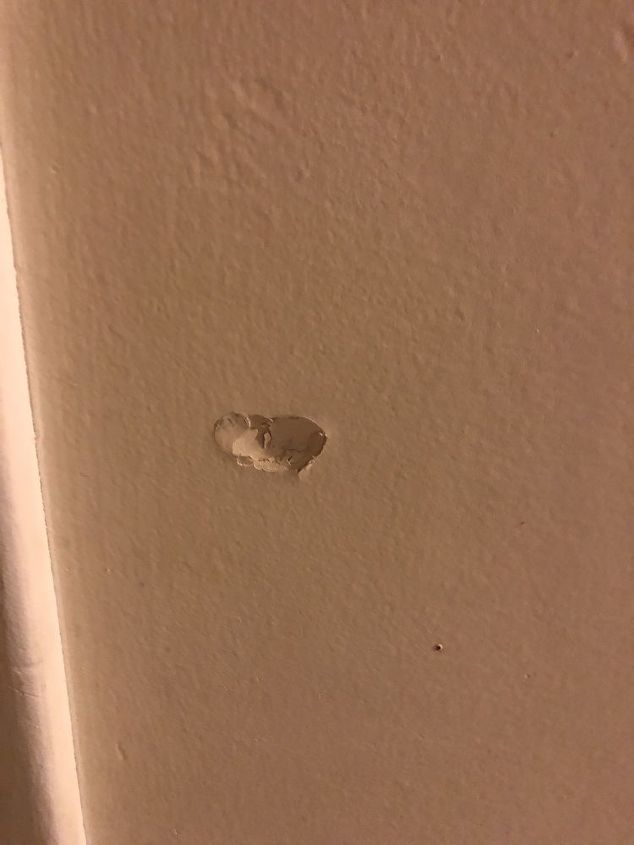 q how can i repair a small dent in my wall