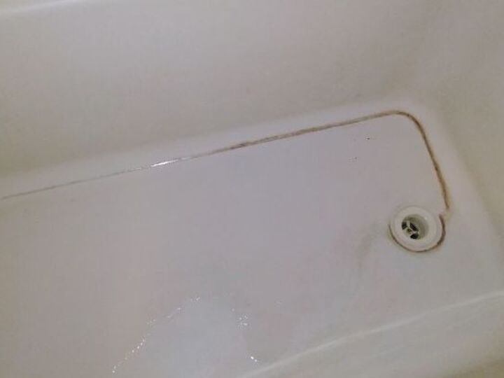 q how do i get build up mineral deposits out of the bottom of my bathtub