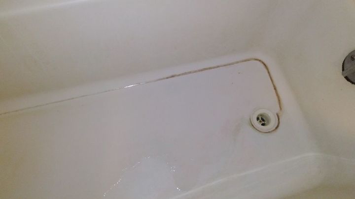 q how do i get build up mineral deposits out of the bottom of my bathtub
