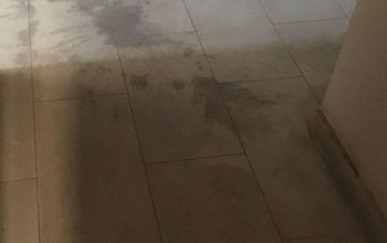 How do I remove large spill stains from marble?