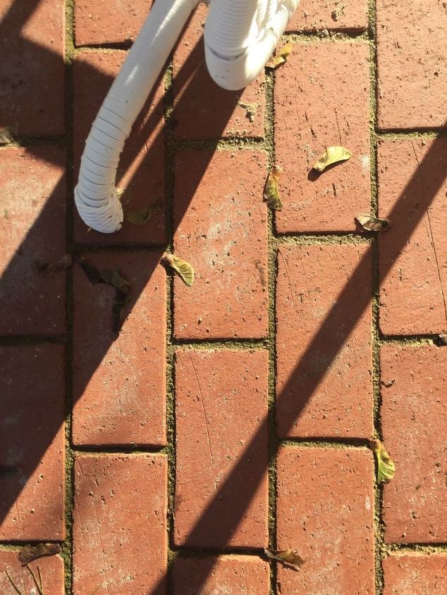 q how do i remove polymeric sandthat dried on our brick pavers