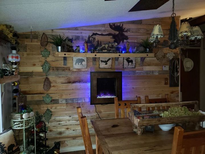 dining area wall clad in reclaimed lumber for less the 10 00