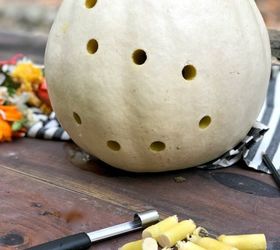 The unexpected reason she pokes holes in a pumpkin