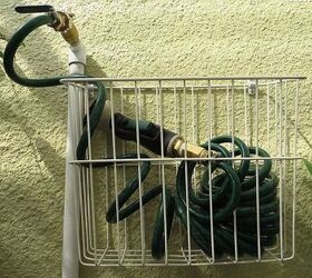 an easy and water saving diy potting bench sink, A repurposed bicycle basket for a garden hose