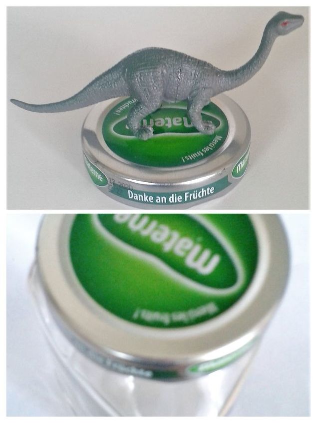 two silver dinosaurs on the lids of decorative jars