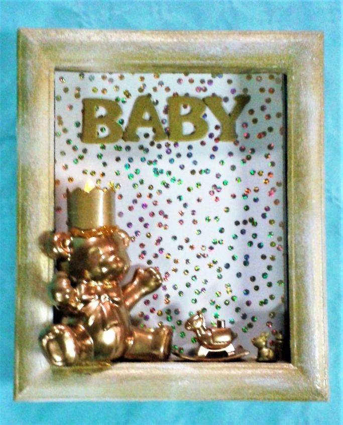 window frame of birth from a vintage recycled frame with teddy bear