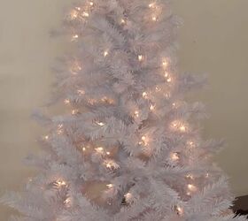 christmas tree decorating blue pink and gold ornaments