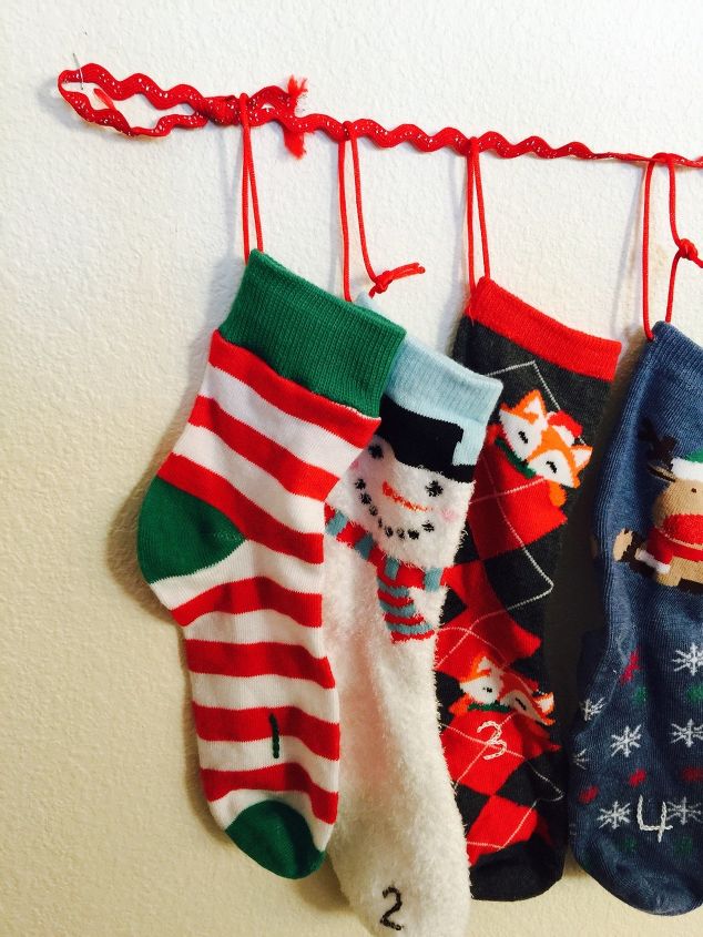 s 19 diy christmas decor ideas that ll rock your holiday, What about an adorable sock advent calendar