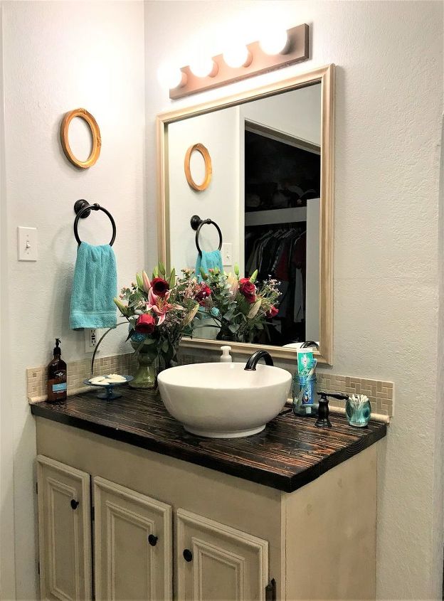 s 15 ways you can transform your bathroom for under 200, Add some cool lights