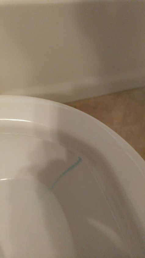 q how do i get rid of the blue stain in toilet bowl