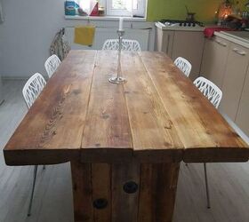 recycled old wood dining table and a chandelier