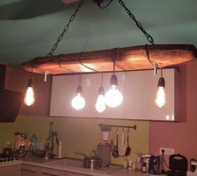 recycled old wood dining table and a chandelier