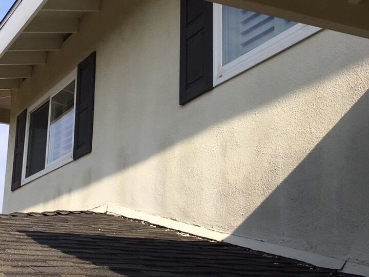 q how can i remove these spots on my exterior stuccoed wall