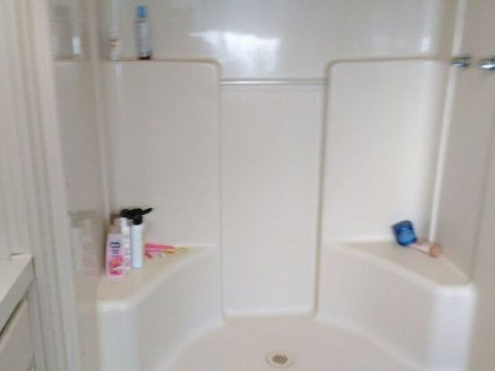 q put a oval bathtub in a square shower in a manufactured home