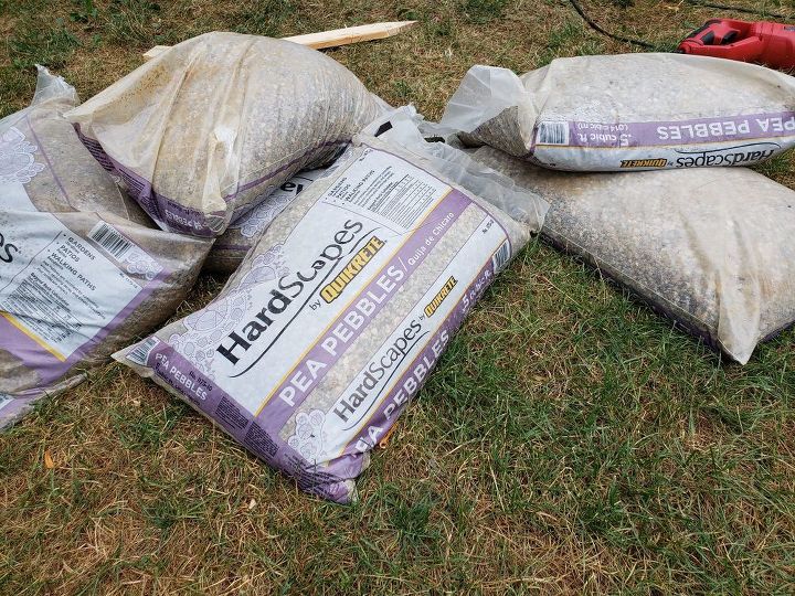 how to use logs as edging for plants make a wall trellis, Pea gravel type pebbles