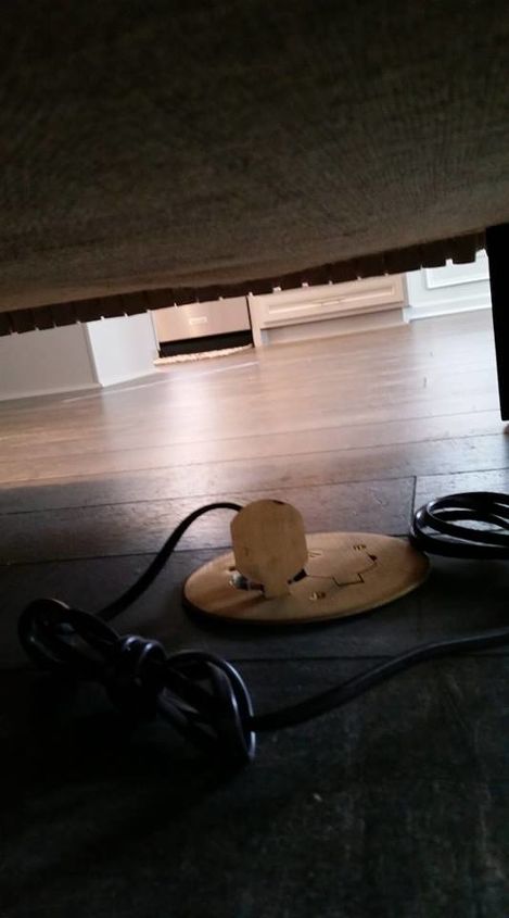 q securing cord under a sofa