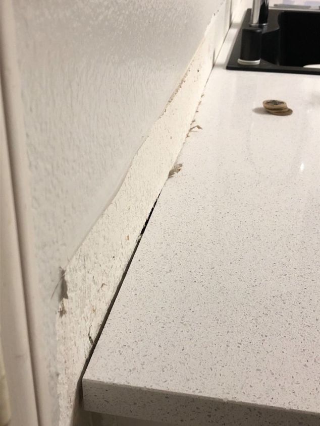 how do i backsplash over wavy drywall