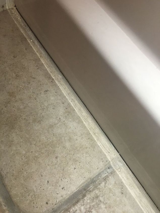 q how to economically fix grout cracks in bathroom